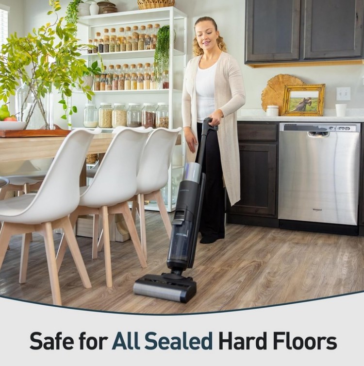 A woman standing in a kitchen with the words safe for sealed hard floors.