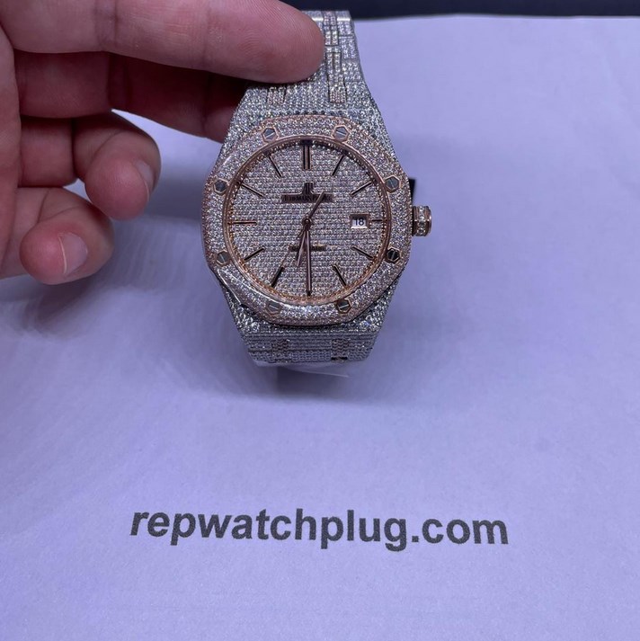 A person is holding a watch with diamonds on it.