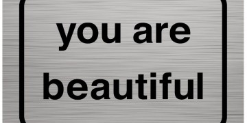 A metal sign that says you are beautiful.