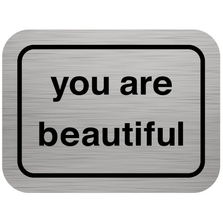 A metal sign that says you are beautiful.