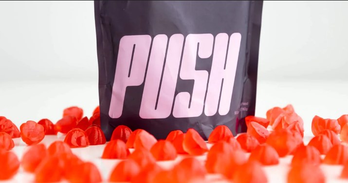 A bag of red gummy bears with the word push on it.