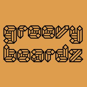 Text logo that reads "groovy beards" in a black, retro geometric font on a tan background.