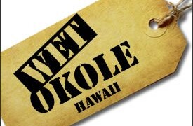 A tag with the text "WET OKOLE HAWAII" in bold black letters is attached by a string.