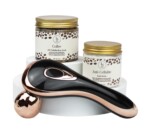Two jars labeled as coffee body scrub and anti-cellulite body butter, and a black and rose gold massage tool, arranged on a white surface.