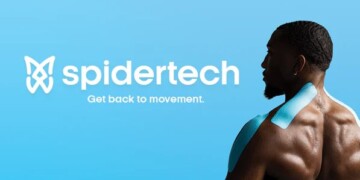 A person with blue kinesiology tape on their shoulder and neck stands in front of a blue background with the text "spidertech" and "Get back to movement.